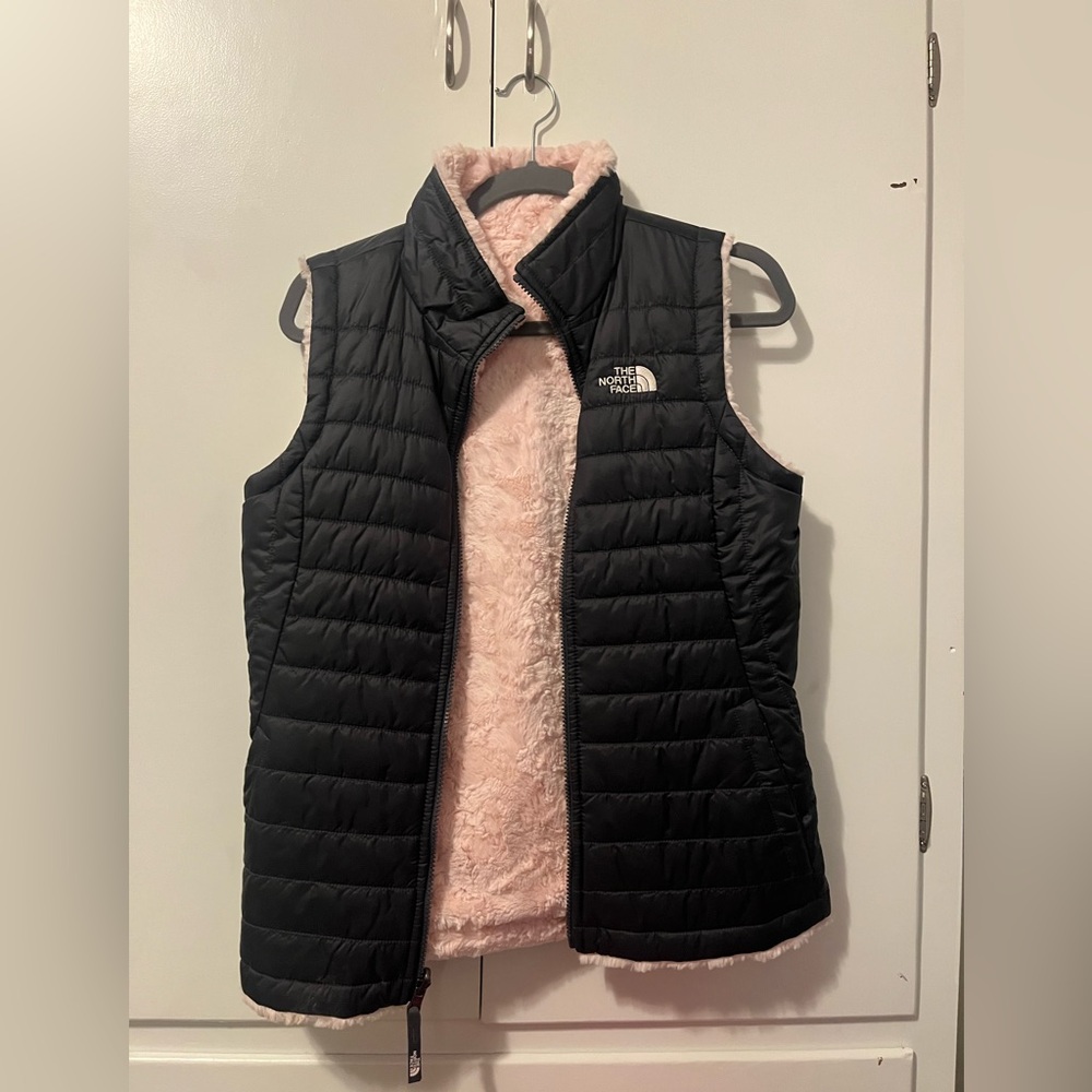 Dark navy blue, and pink North face vest